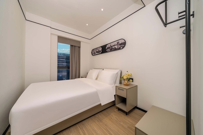 Imagen de la habitación del Hotel Dahua Group Xinn. Foto 5