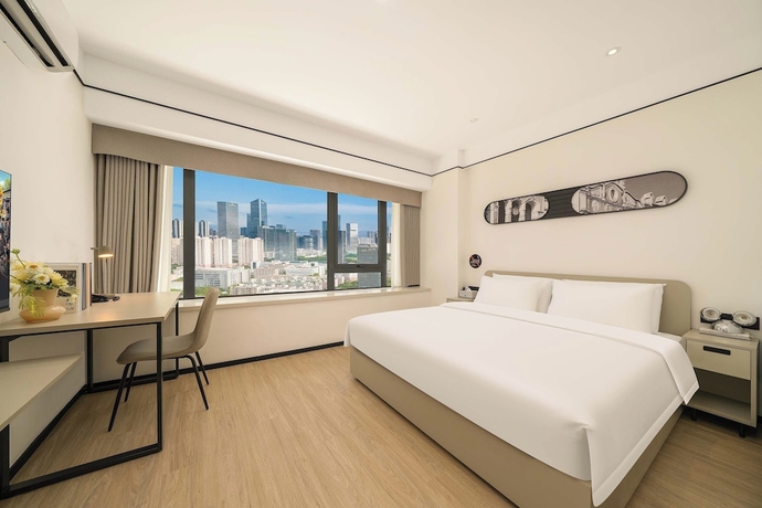 Imagen de la habitación del Hotel Dahua Group Xinn. Foto 8