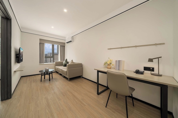 Imagen de la habitación del Hotel Dahua Group Xinn. Foto 10
