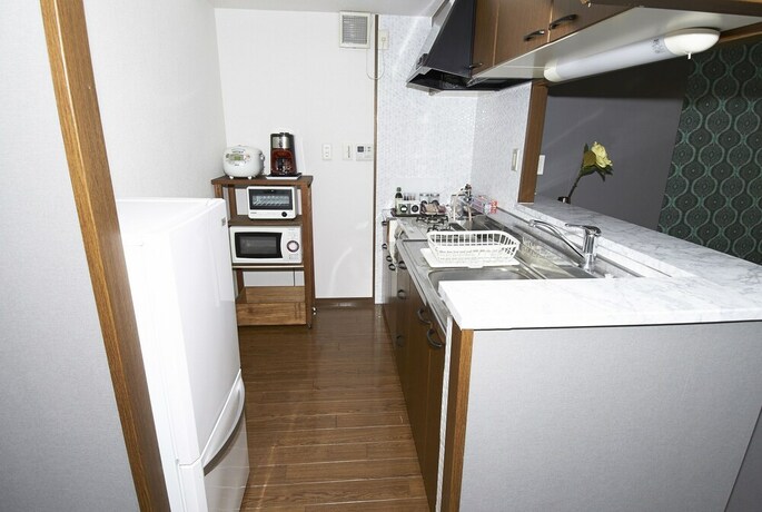 Imagen de la habitación del Hotel Dai-san Okamoto Building. Foto 21