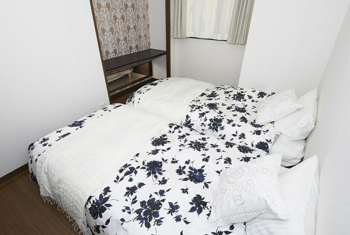 Imagen de la habitación del Hotel Dai-san Okamoto Building. Foto 22