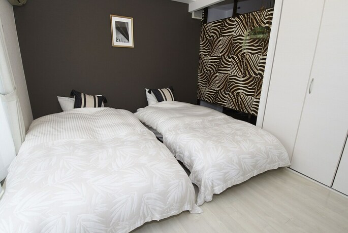 Imagen de la habitación del Hotel Dai-san Okamoto Building. Foto 32