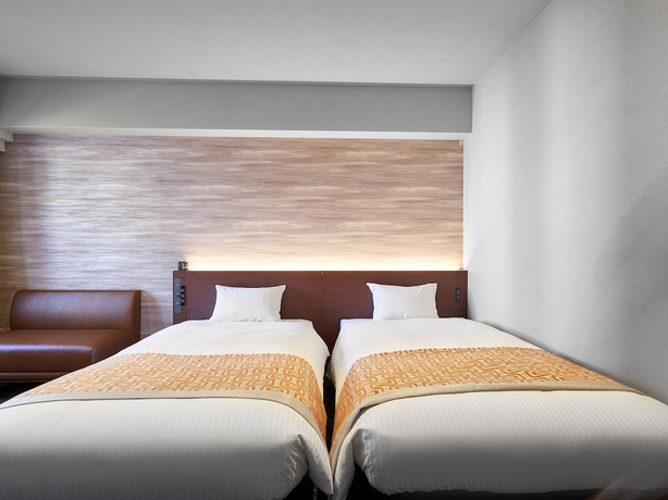 Imagen de la habitación del Hotel Daiwa Roynet KUMAMOTO GINZADORI PREMIER. Foto 11