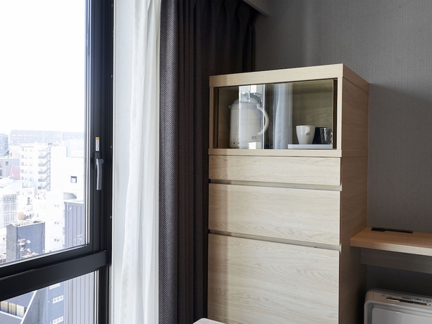 Imagen de la habitación del Hotel Daiwa Roynet KUMAMOTO GINZADORI PREMIER. Foto 13