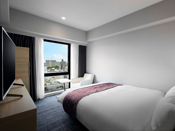 Imagen de la habitación del Hotel Daiwa Roynet KUMAMOTO GINZADORI PREMIER. Foto 16