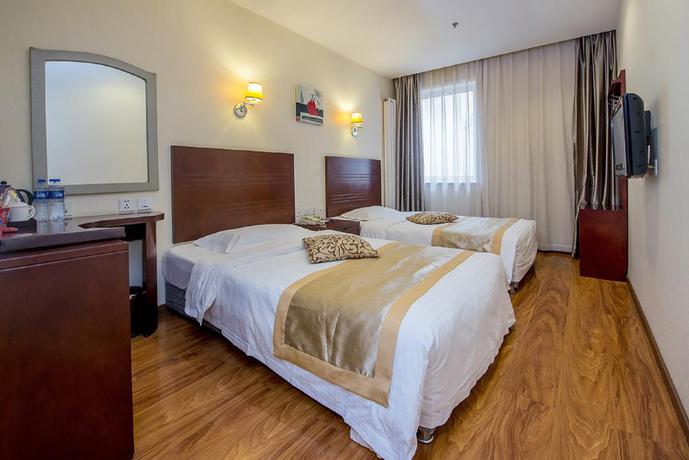 Imagen de la habitación del Hotel Dajiaoting International Business Hotel. Foto 11