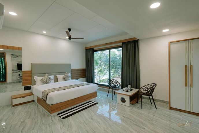Imagen de la habitación del Hotel Daksh Eden Greenz -a Luxury Resort. Foto 22