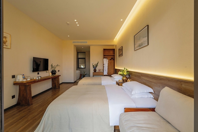 Imagen de la habitación del Hotel Dali Buxi Wellness Villa. Foto 7