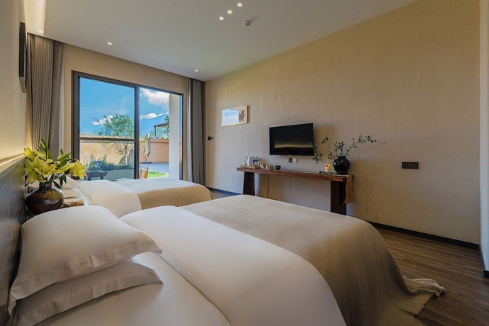 Imagen de la habitación del Hotel Dali Buxi Wellness Villa. Foto 15