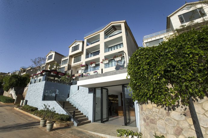 Imagen de la habitación del Hotel Dali Junbo Holiday Villa. Foto 6