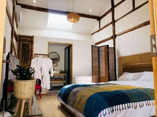 Imagen de la habitación del Hotel Dali Orchard Suites. Foto 12