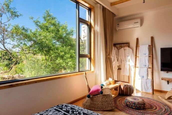 Imagen de la habitación del Hotel Dali Orchard Suites. Foto 13
