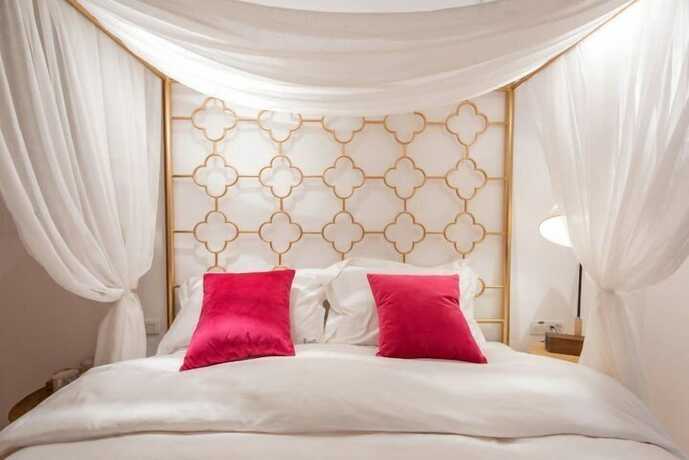 Imagen de la habitación del Hotel Dali Orchard Suites. Foto 19