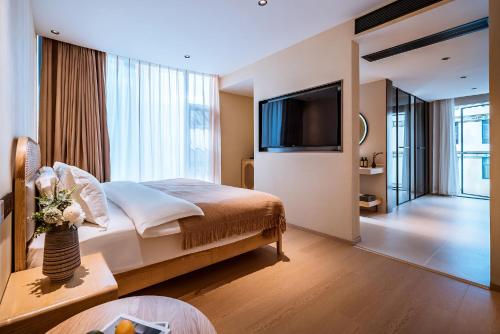 Imagen de la habitación del Hotel Dali Qingdu Inn. Foto 17