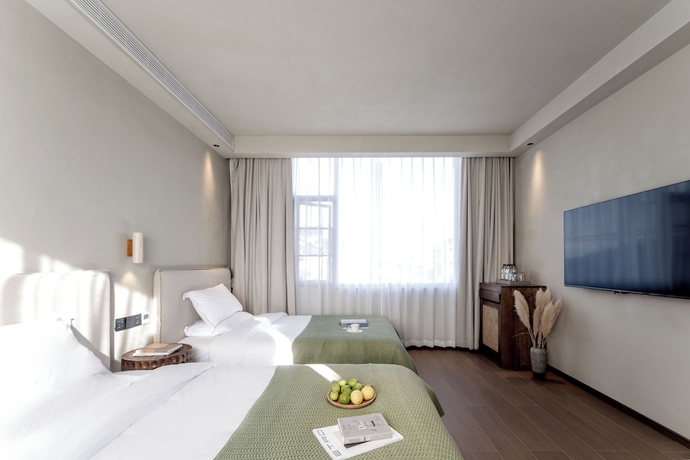 Imagen de la habitación del Hotel Dali Qingmai Seaview Resort. Foto 7