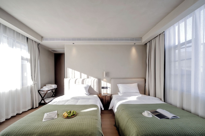 Imagen de la habitación del Hotel Dali Qingmai Seaview Resort. Foto 8