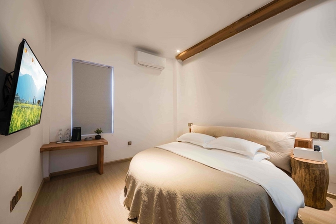 Imagen de la habitación del Hotel Dali Sky and Erhai Sea View Holiday Inn. Foto 8