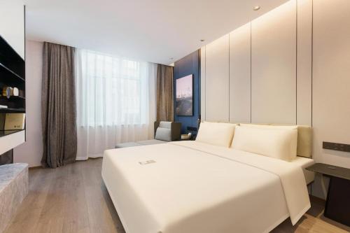 Imagen de la habitación del Hotel Dalian Airport Yingke Road Atour Hotel. Foto 9