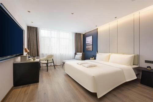 Imagen de la habitación del Hotel Dalian Airport Yingke Road Atour Hotel. Foto 14