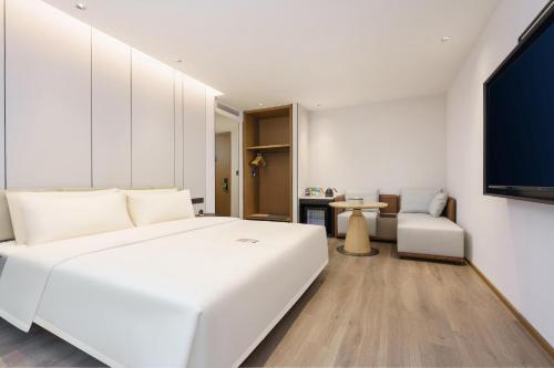 Imagen de la habitación del Hotel Dalian Airport Yingke Road Atour Hotel. Foto 15