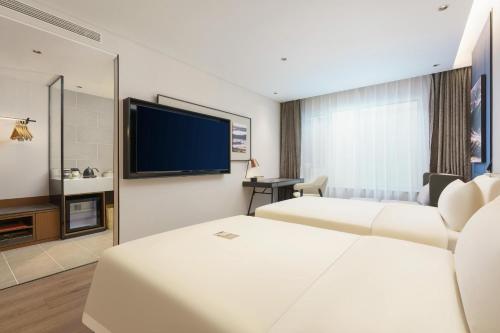 Imagen de la habitación del Hotel Dalian Airport Yingke Road Atour Hotel. Foto 19