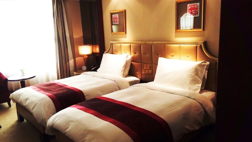 Imagen de la habitación del Hotel Dalian Dynasty International. Foto 4