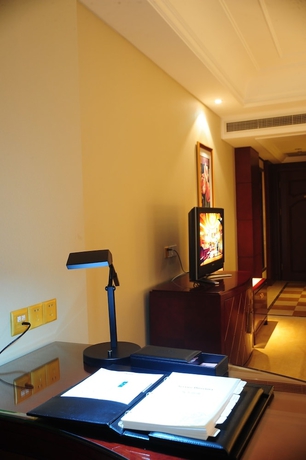 Imagen de la habitación del Hotel Dalian Dynasty International. Foto 5