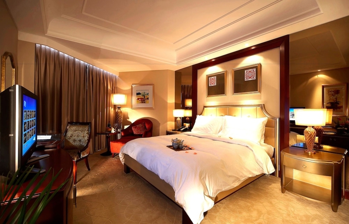Imagen de la habitación del Hotel Dalian Dynasty International. Foto 10