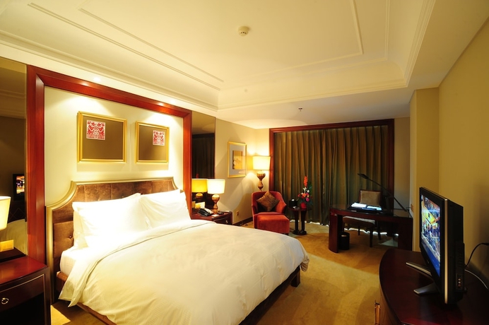 Imagen de la habitación del Hotel Dalian Dynasty International. Foto 11