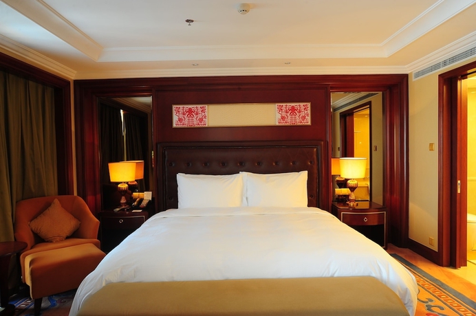 Imagen de la habitación del Hotel Dalian Dynasty International. Foto 12