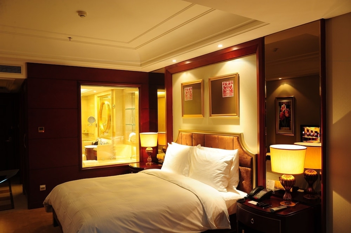Imagen de la habitación del Hotel Dalian Dynasty International. Foto 14