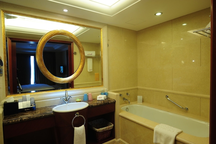 Imagen de la habitación del Hotel Dalian Dynasty International. Foto 16