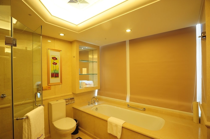 Imagen de la habitación del Hotel Dalian Dynasty International. Foto 17