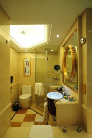 Imagen de la habitación del Hotel Dalian Dynasty International. Foto 18