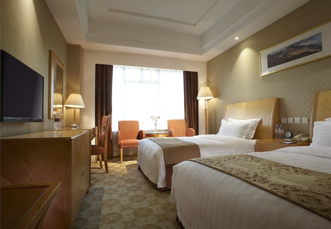Imagen de la habitación del Hotel Dalian East. Foto 8