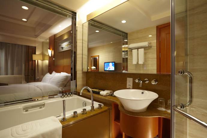 Imagen de la habitación del Hotel Dalian East. Foto 9