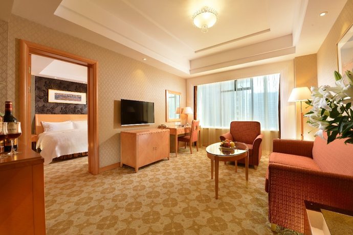 Imagen de la habitación del Hotel Dalian East. Foto 11