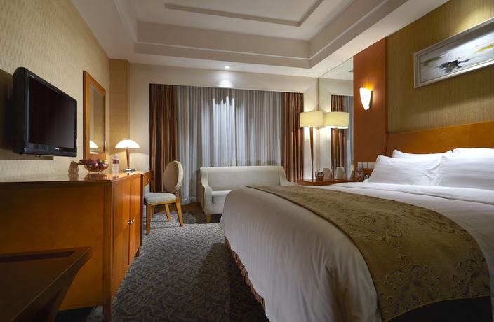 Imagen de la habitación del Hotel Dalian East. Foto 12