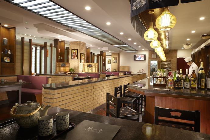 Imagen del bar/restaurante del Hotel Dalian East. Foto 6
