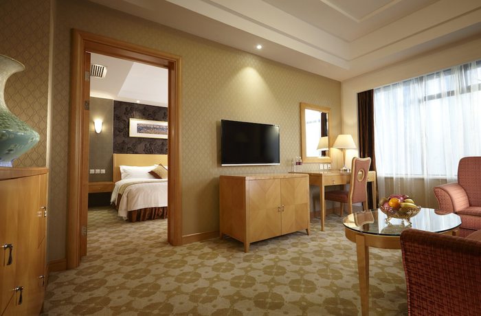 Imagen de la habitación del Hotel Dalian East. Foto 16
