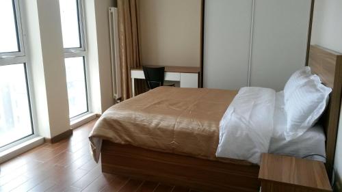 Imagen de la habitación del Hotel Dalian Jiayihe. Foto 6