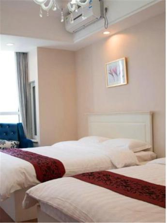 Imagen de la habitación del Hotel Dalian Jiayihe. Foto 8