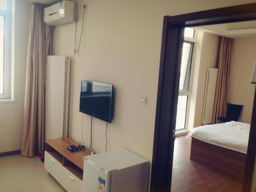 Imagen de la habitación del Hotel Dalian Jiayihe. Foto 9