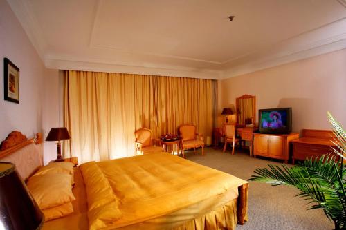 Imagen de la habitación del Hotel Dalian Jinshi International Convention Center. Foto 7