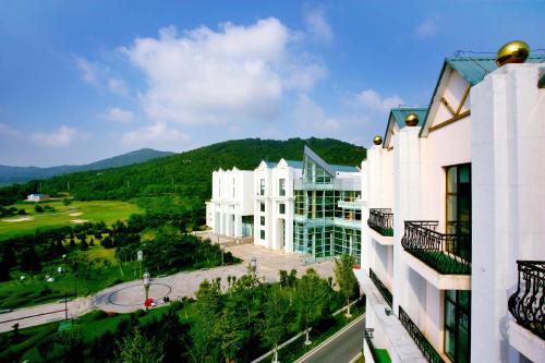 Imagen de la habitación del Hotel Dalian Jinshi International Convention Center. Foto 8