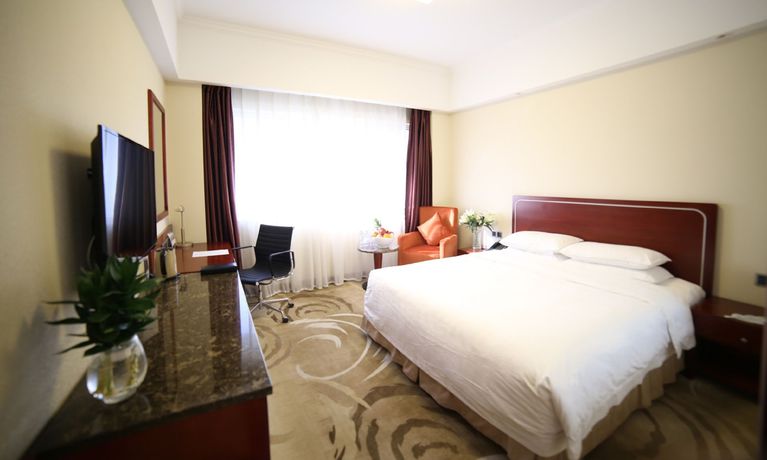 Imagen de la habitación del Hotel Dalian Kerren. Foto 7