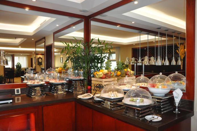Imagen del bar/restaurante del Hotel Dalian Kerren. Foto 3
