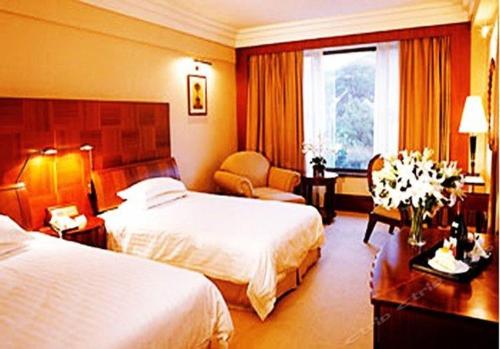 Imagen de la habitación del Hotel Dalian Nanshan Garden. Foto 9