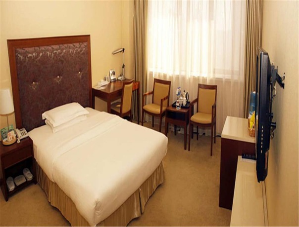 Imagen de la habitación del Hotel Dalian Royal. Foto 2