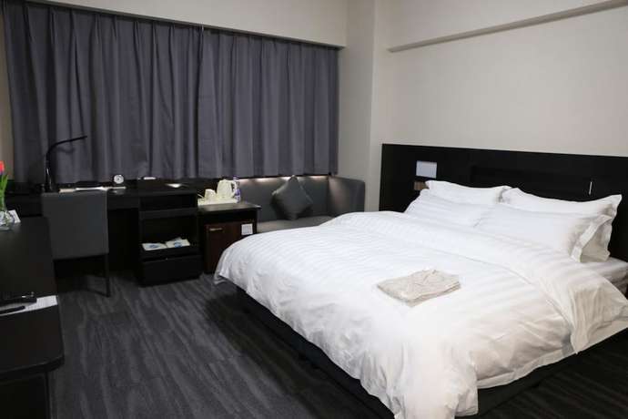 Imagen de la habitación del Hotel Dalian Royal. Foto 5